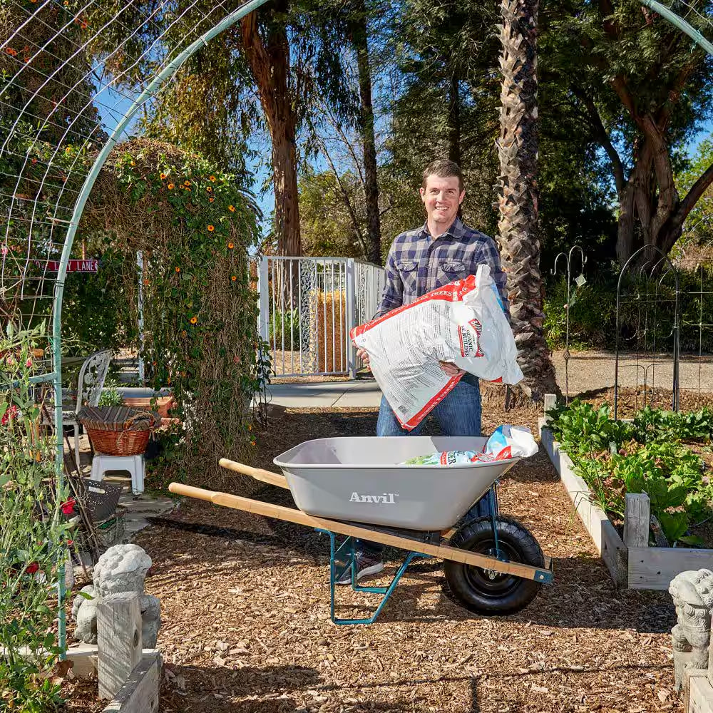 6 Cu. Ft. Steel Tub Wheelbarrow with Wooden Handles and Pneumatic Tire